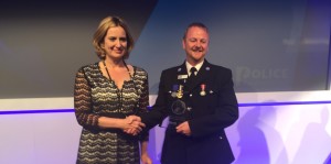 Sean Cannon receives award from Amber Rudd